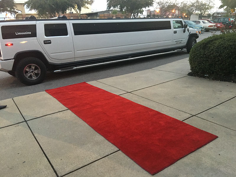 Stretch Hummer Limo in Columbia SC greets clients with a red carpet welcome
